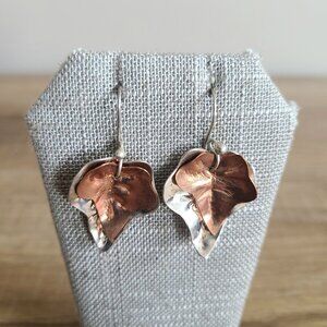 Sterling silver and copper dangling earrings leaf shape.